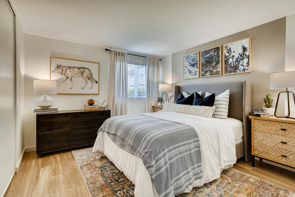 Furnished bedroom with a gray accent wall in our Everett apartments.